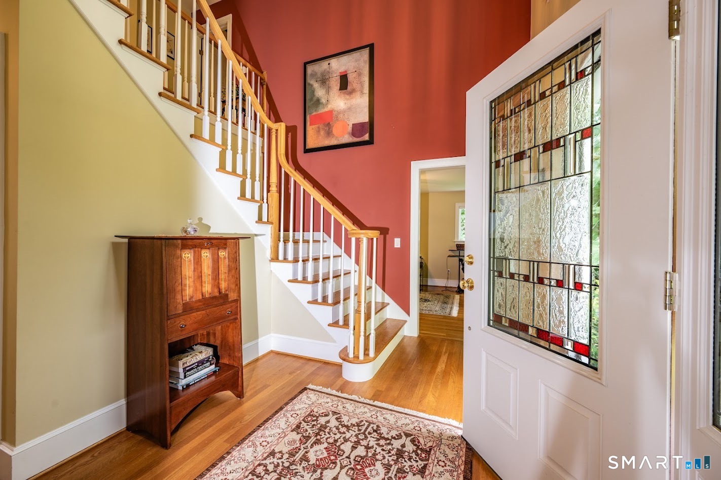 35 Anderson Lane Durham, CT 06422 - Photo 11 of 25 Welcoming two-story foyer with hardwood floors, elegant turned staircase, and decorative glass front door creating a bright first impression.