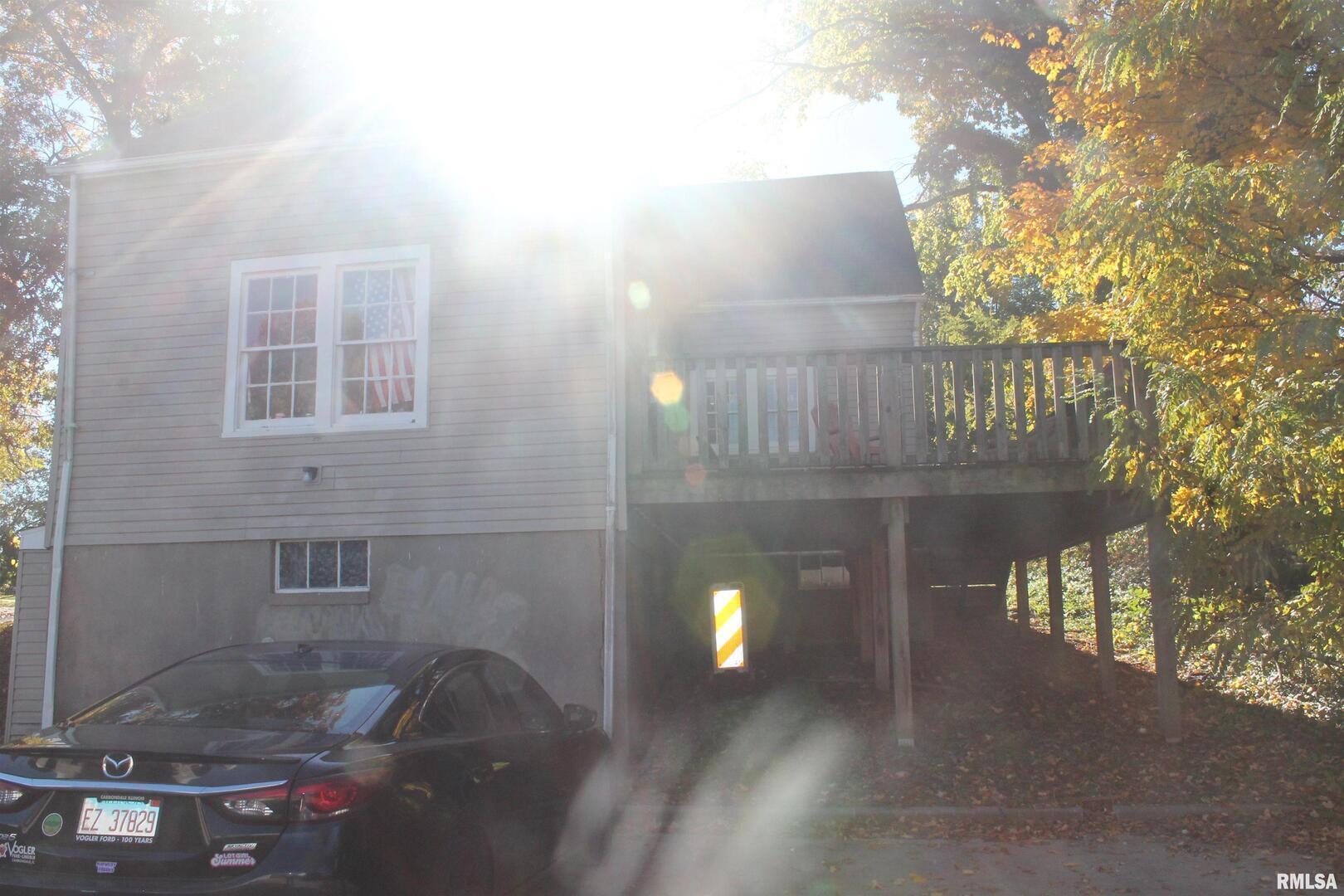 502 West Freeman Street, Unit 1 Carbondale, IL 62901 - Photo 6 of 17 a view of a porch with a yard