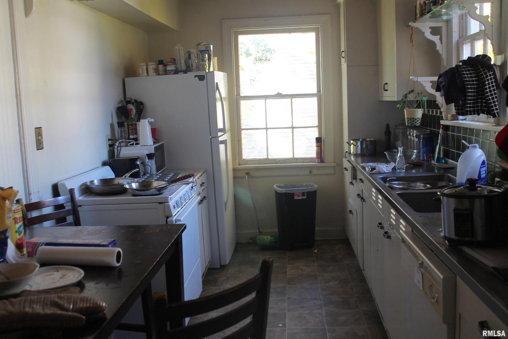 502 West Freeman Street, Unit 1 Carbondale, IL 62901 - Photo 9 of 17 a kitchen with a stove and a wooden floor