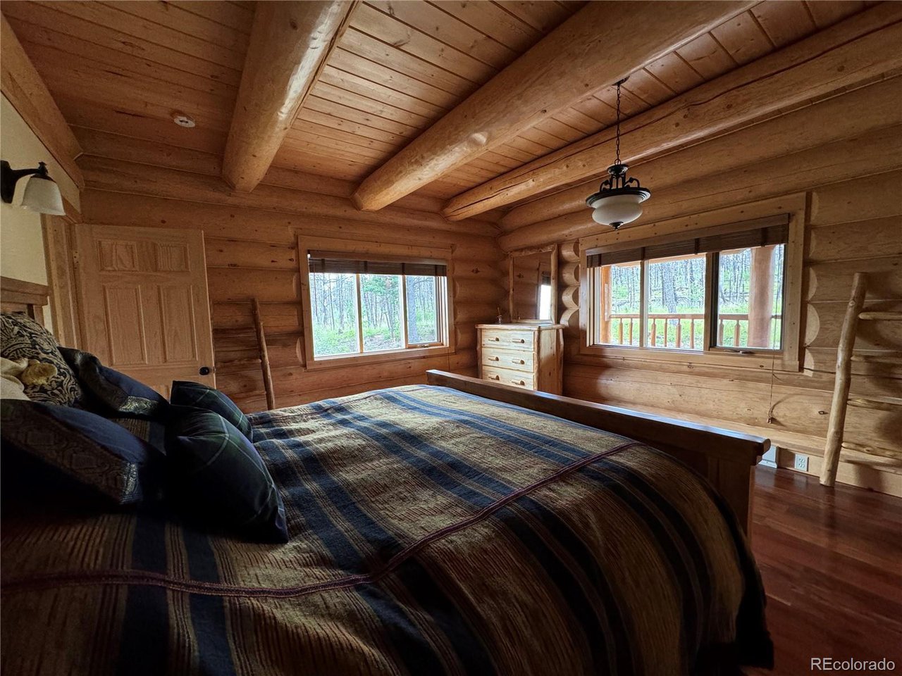 2255 Port Loop Fort Garland, CO 81133 - Photo 11 of 42 a bed sitting in a bedroom next to a window