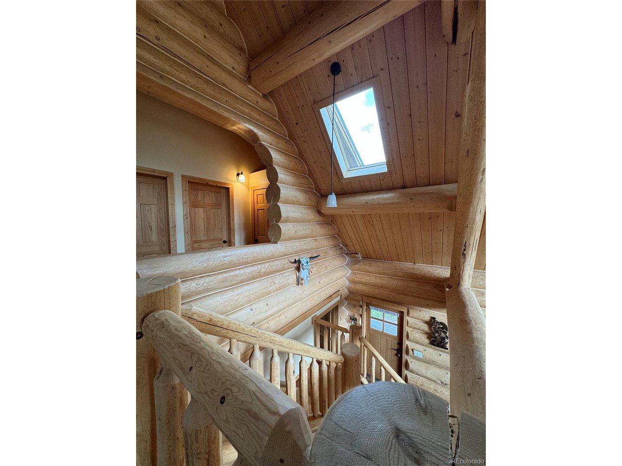 2255 Port Loop Fort Garland, CO 81133 - Photo 36 of 42 a view of staircase with railing and white walls