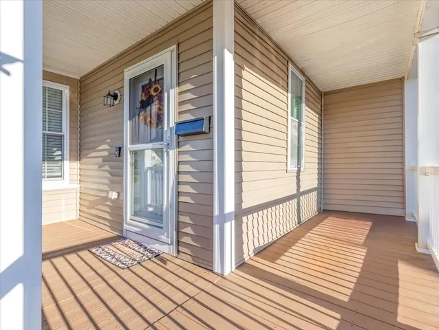 a view of a balcony with wooden floor