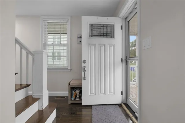 a view of front door with wooden floor