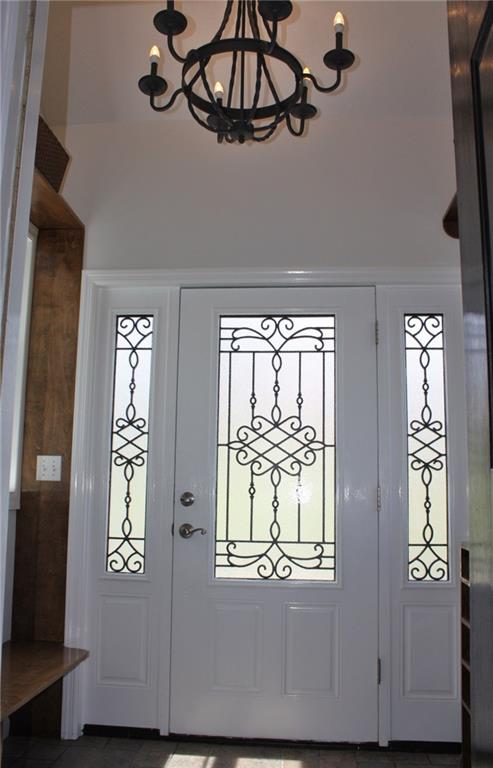 81 Bellview Circle McKees Rocks, PA 15136 - Photo 2 of 24 Gorgeous Custom Entry with bench, built-ins, hooks, iron chandelier, and ceramic flooring