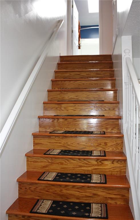 81 Bellview Circle McKees Rocks, PA 15136 - Photo 11 of 24 Wood Staircase with wider than usual stairs!