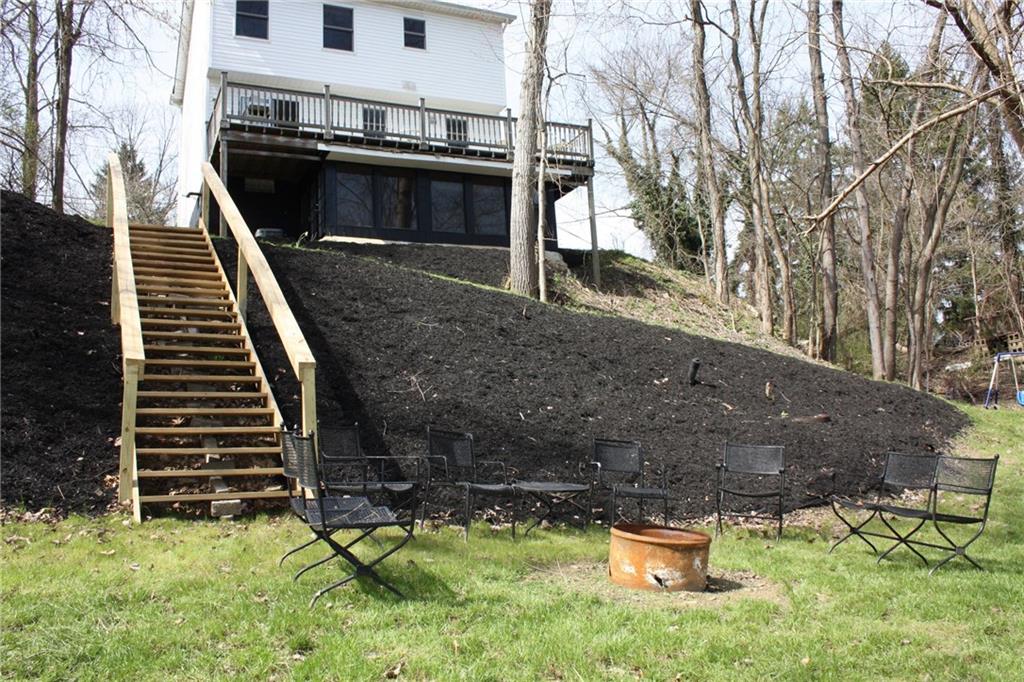 81 Bellview Circle McKees Rocks, PA 15136 - Photo 22 of 24 Exterior back and backyard with fire pit area. Swing set to the right included or removed.