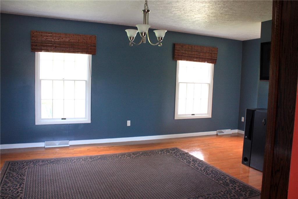 81 Bellview Circle McKees Rocks, PA 15136 - Photo 7 of 24 Living Room with hardwood floor, built-in cabinetry, and TV