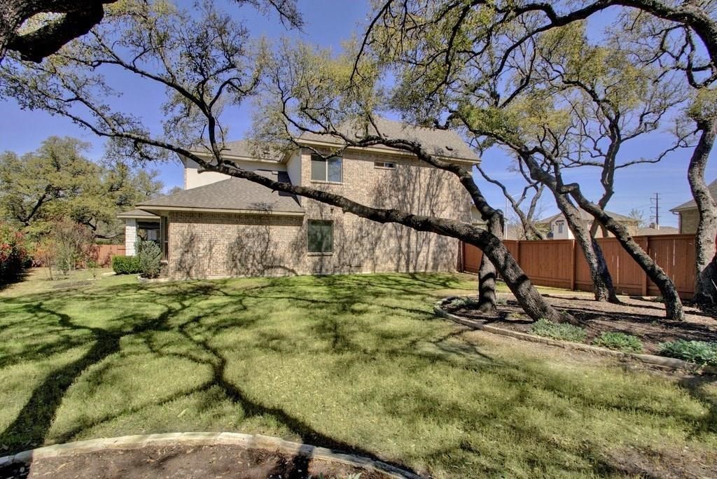 10825 Ballard Path Austin, TX 78717 - Photo 39 of 39 a view of a backyard with plants and large trees