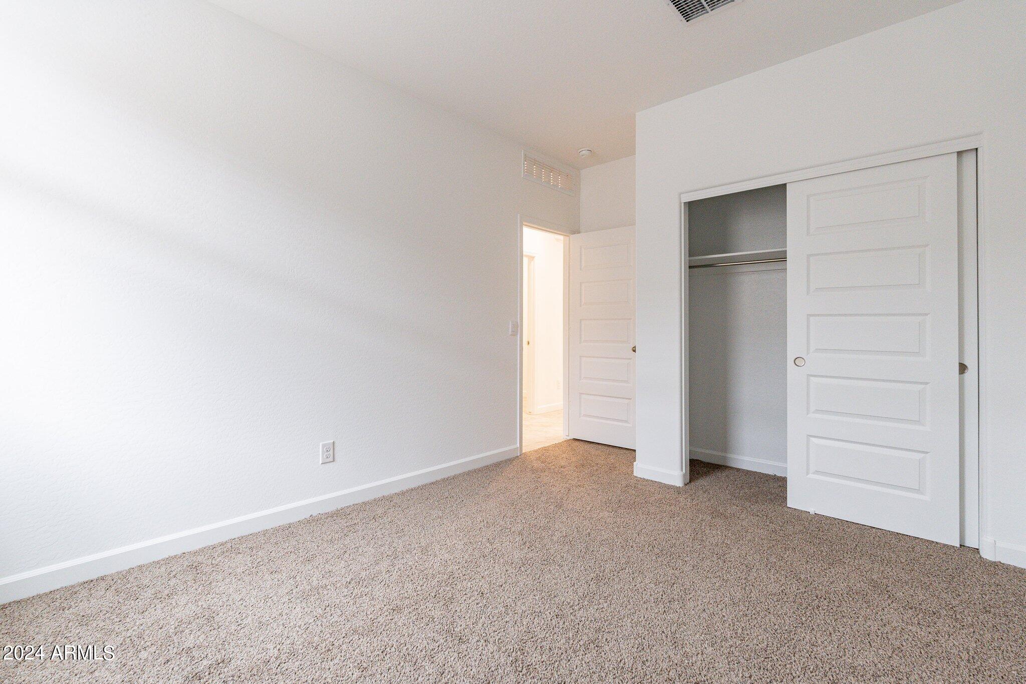5447 Azara Drive San Tan Valley, AZ 85140 - Photo 16 of 21 an empty room with closet area