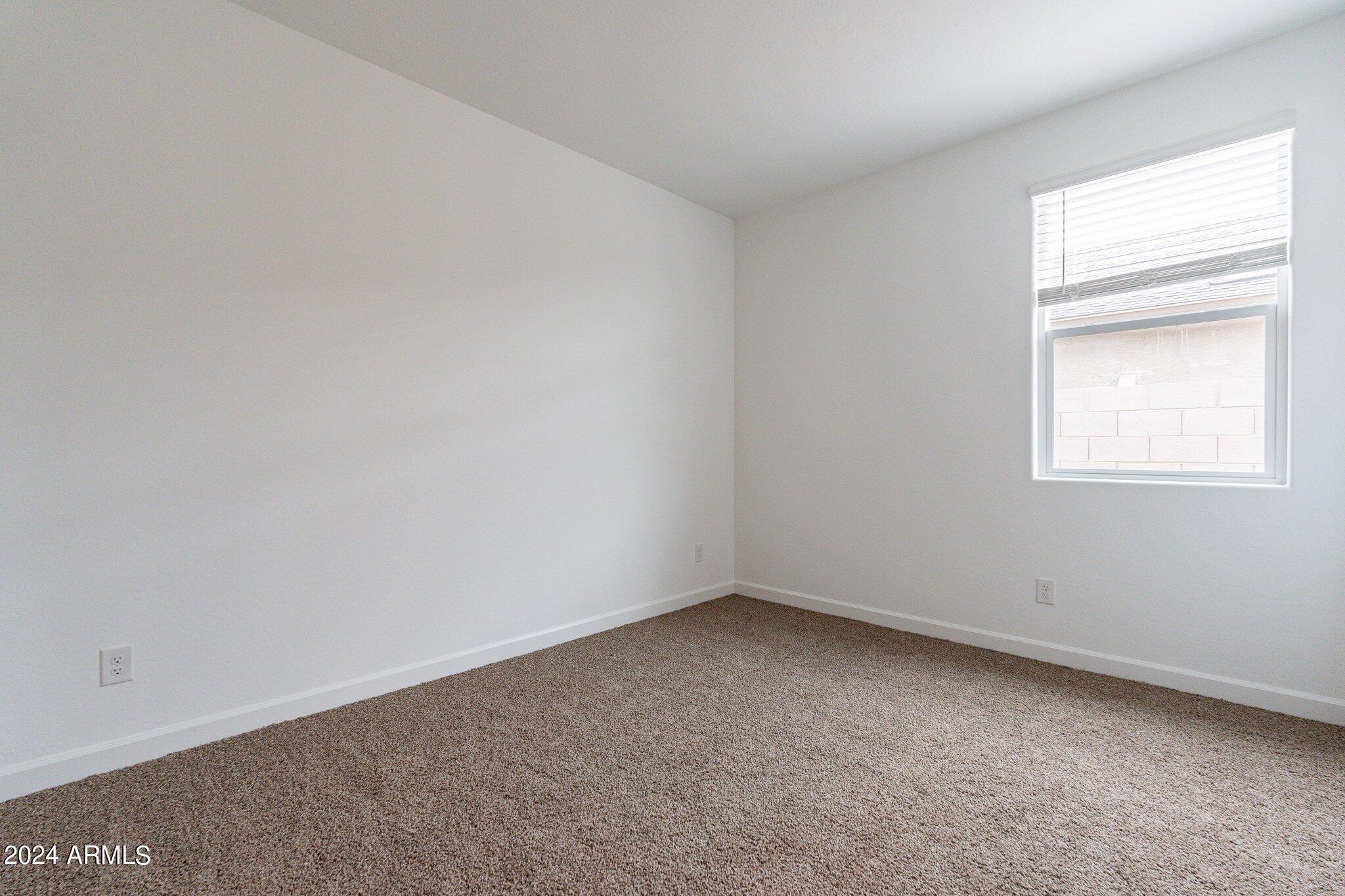5447 Azara Drive San Tan Valley, AZ 85140 - Photo 17 of 21 an empty room with a window