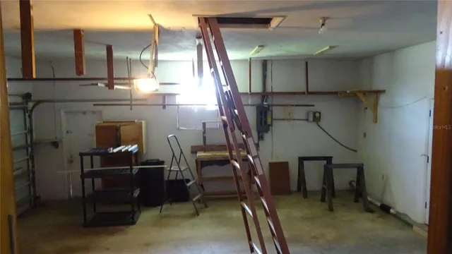 a hallway with a washer and dryer