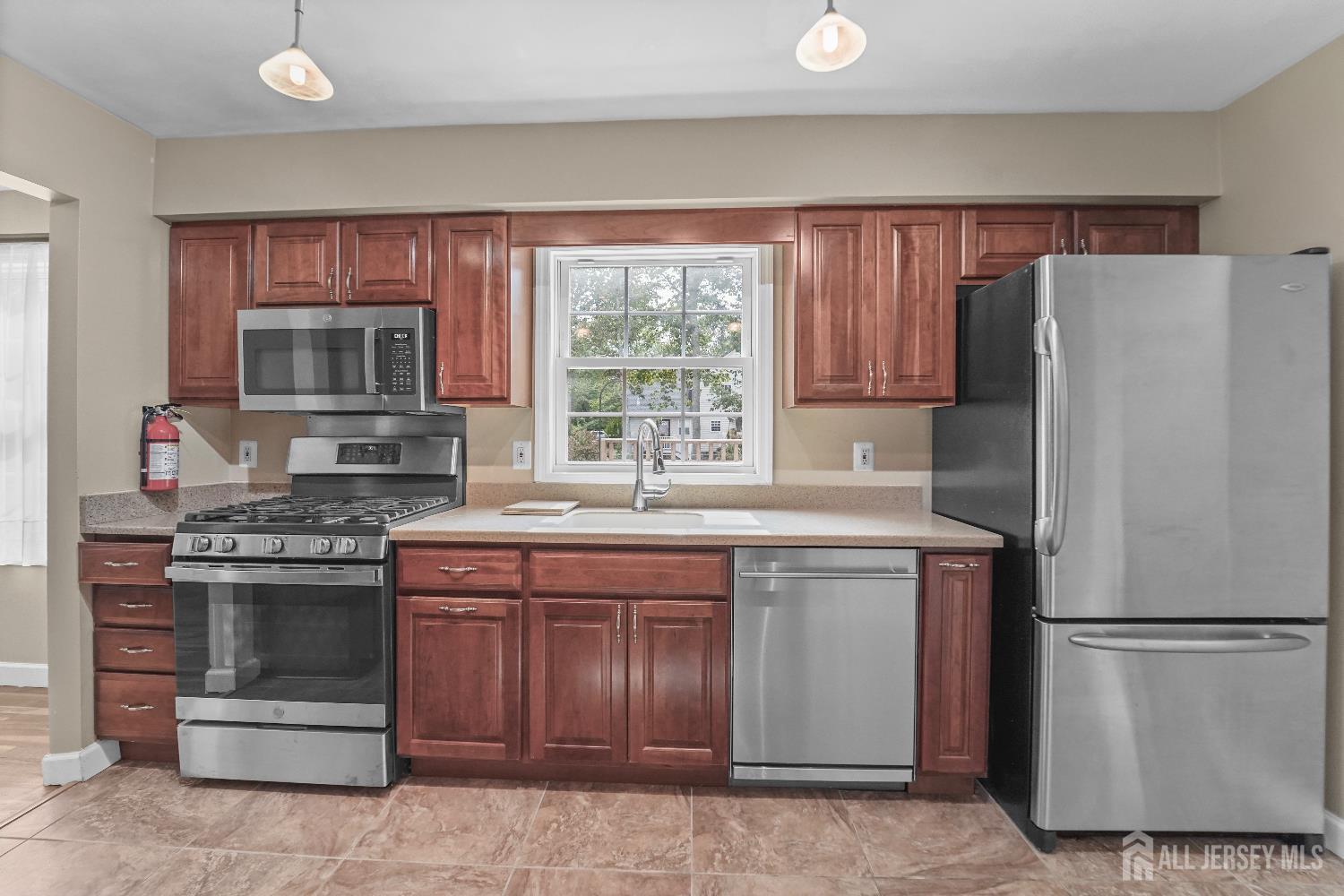 169 Docare Road Jackson, NJ 08527 - Photo 11 of 21 a kitchen with a stove top oven and refrigerator