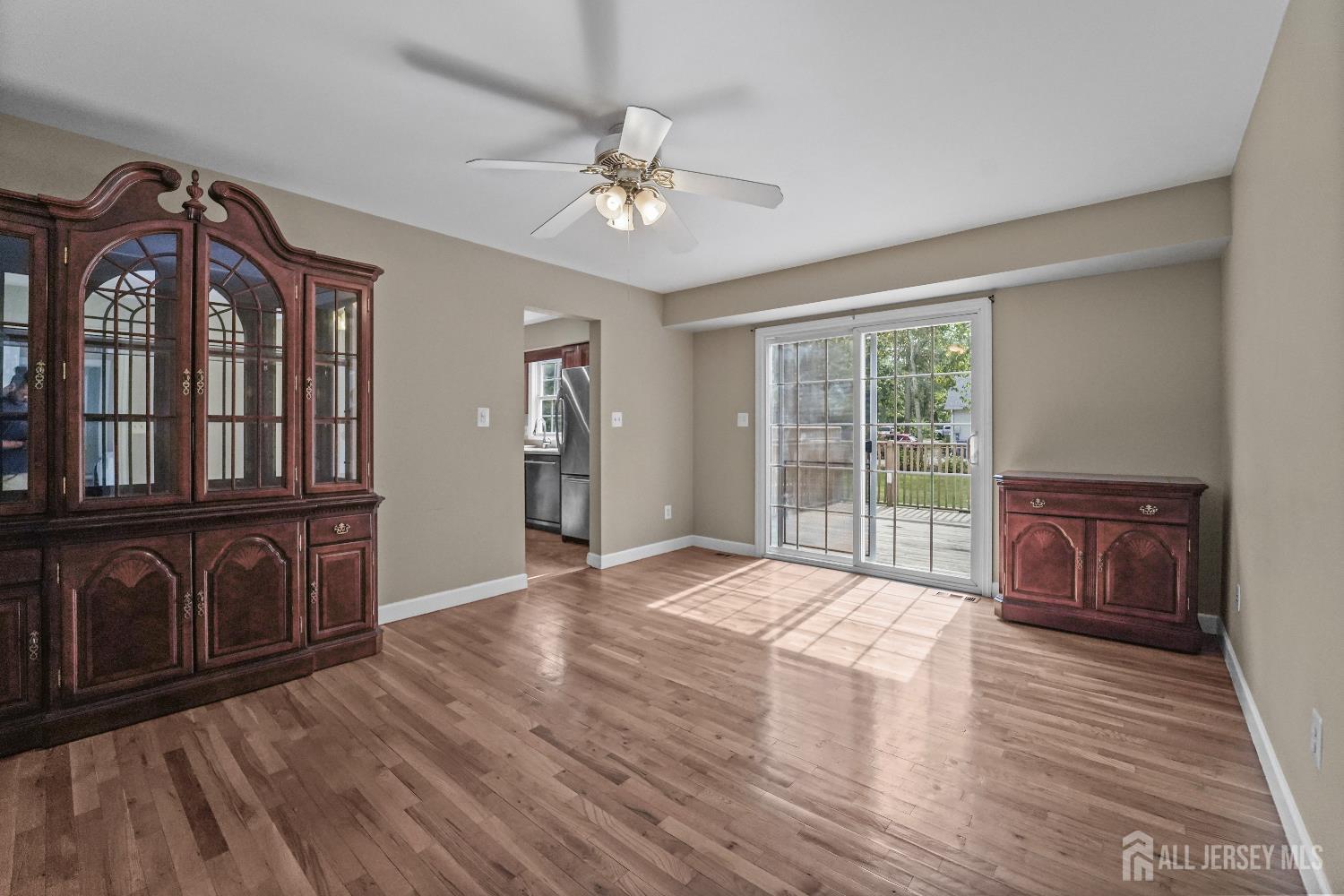 169 Docare Road Jackson, NJ 08527 - Photo 12 of 21 a view of a livingroom with furniture chandelier fan and wooden floor