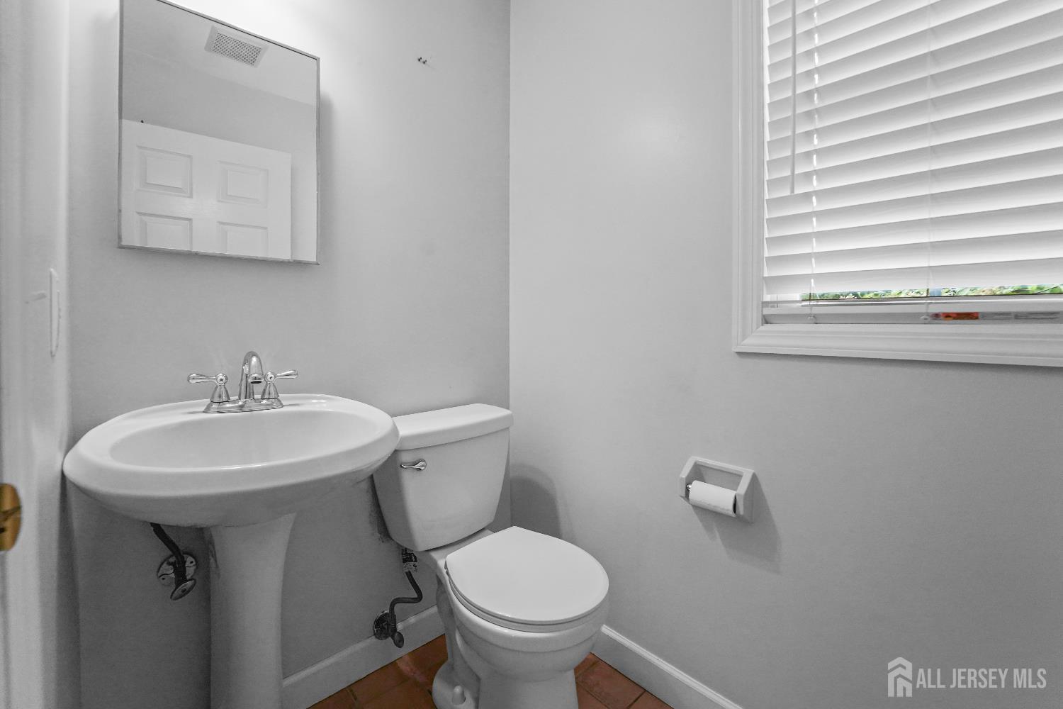 169 Docare Road Jackson, NJ 08527 - Photo 13 of 21 a white toilet sitting next to a white sink