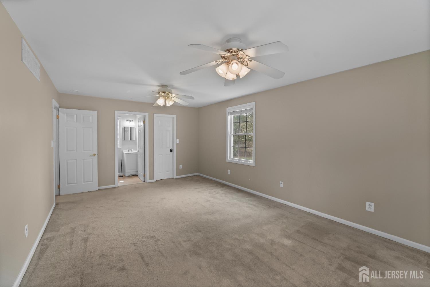 169 Docare Road Jackson, NJ 08527 - Photo 15 of 21 a view of an empty room with a chandelier fan