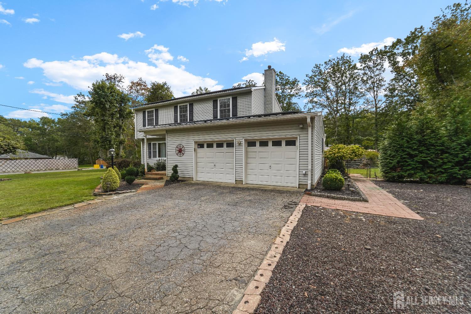 169 Docare Road Jackson, NJ 08527 - Photo 2 of 21 a front view of a house with a yard and garage