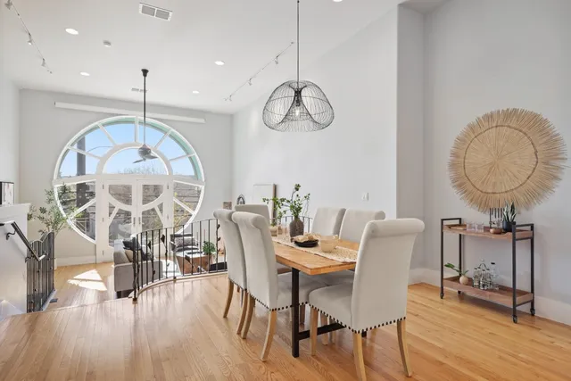 a view of a dining room with furniture window and wooden floor