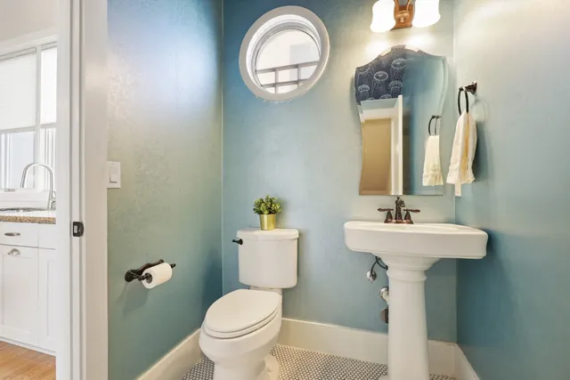 a bathroom with 2 sink and a mirror
