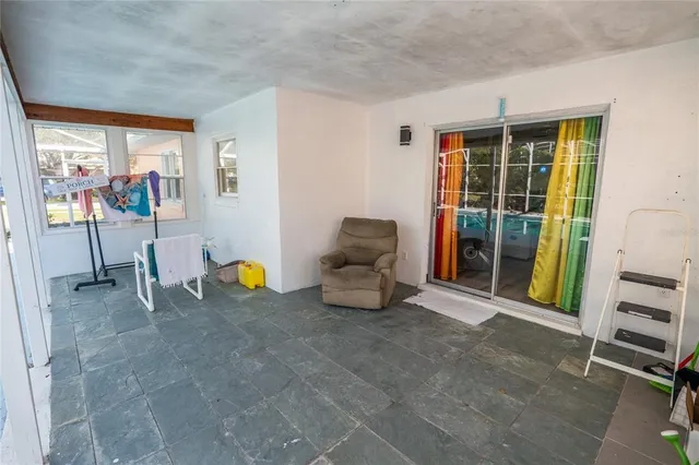 a view of a livingroom with furniture and a flat screen tv