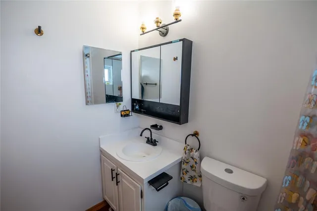 a bathroom with a tub and a shower curtain