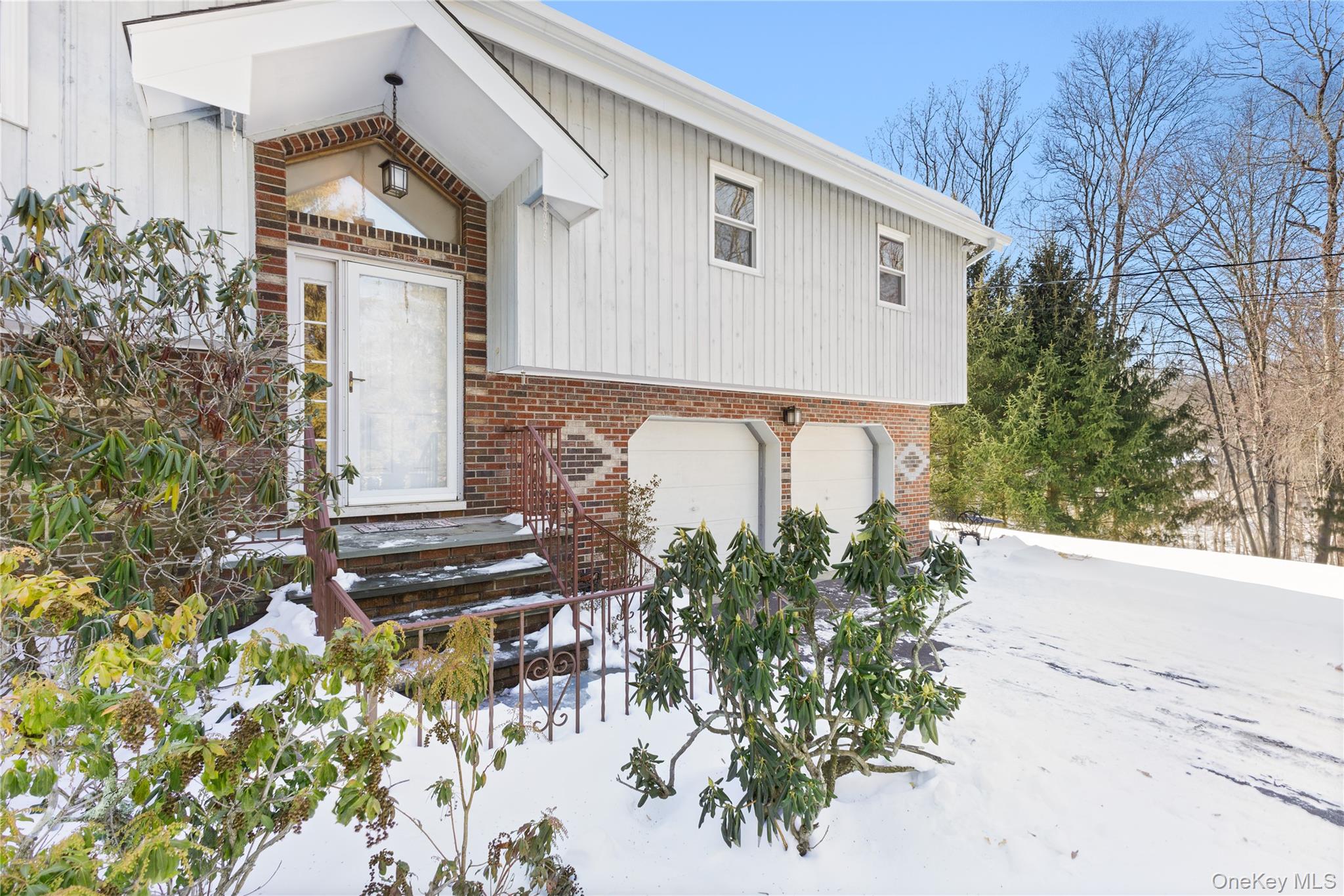 Come home to this wonderful raised ranch with brick accents, double garage, and welcoming front entry.