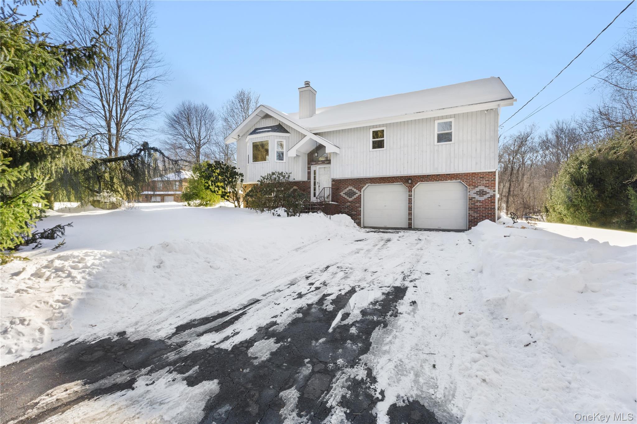 7 Cimarron Road Putnam Valley, NY 10579 - Photo 2 of 50 A long, welcoming driveway creates a beautiful sense of arrival and privacy from the moment you enter the property.
