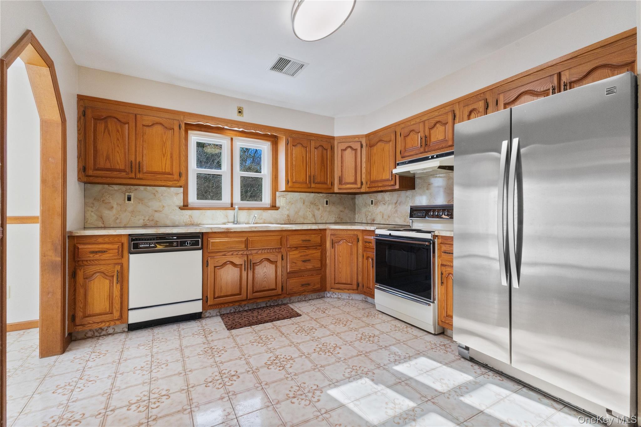 7 Cimarron Road Putnam Valley, NY 10579 - Photo 21 of 50 Bright, functional kitchen with solid wood cabinetry, ample prep space, and stainless steel appliances.