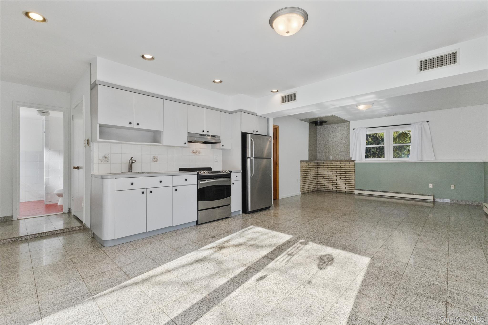 7 Cimarron Road Putnam Valley, NY 10579 - Photo 39 of 50 Expansive lower-level living area with recessed lighting, easy-care tile floors, and flexible space for recreation, media, or guests.
