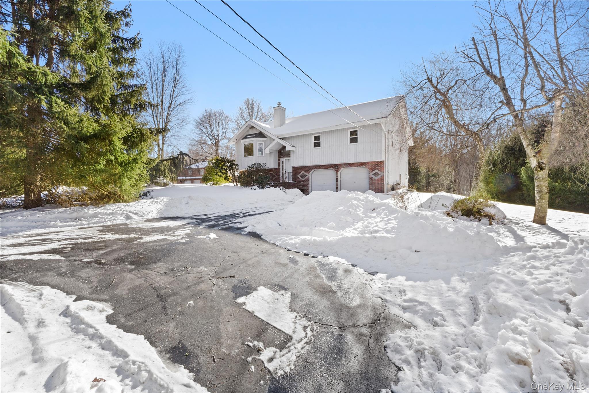 7 Cimarron Road Putnam Valley, NY 10579 - Photo 4 of 50 Driveway includes two additional parking spaces.