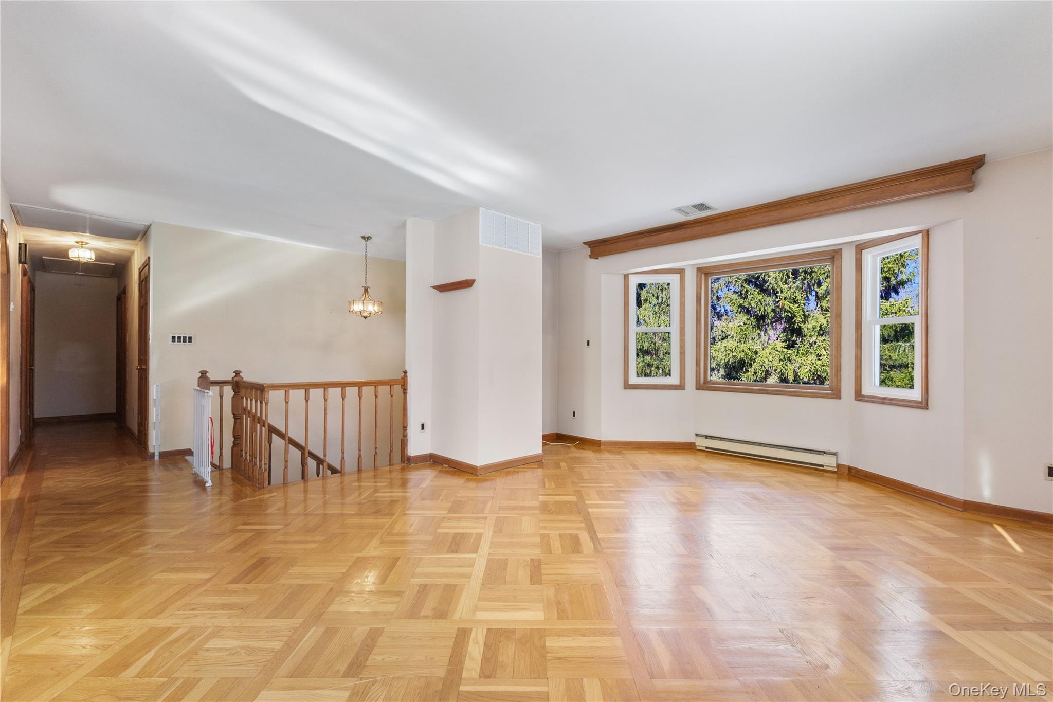 7 Cimarron Road Putnam Valley, NY 10579 - Photo 9 of 50 Bright, open living area with detailed parquet flooring and large picture windows.