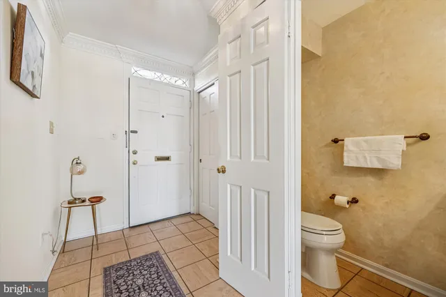 a view of a livingroom with an empty space and wooden floor