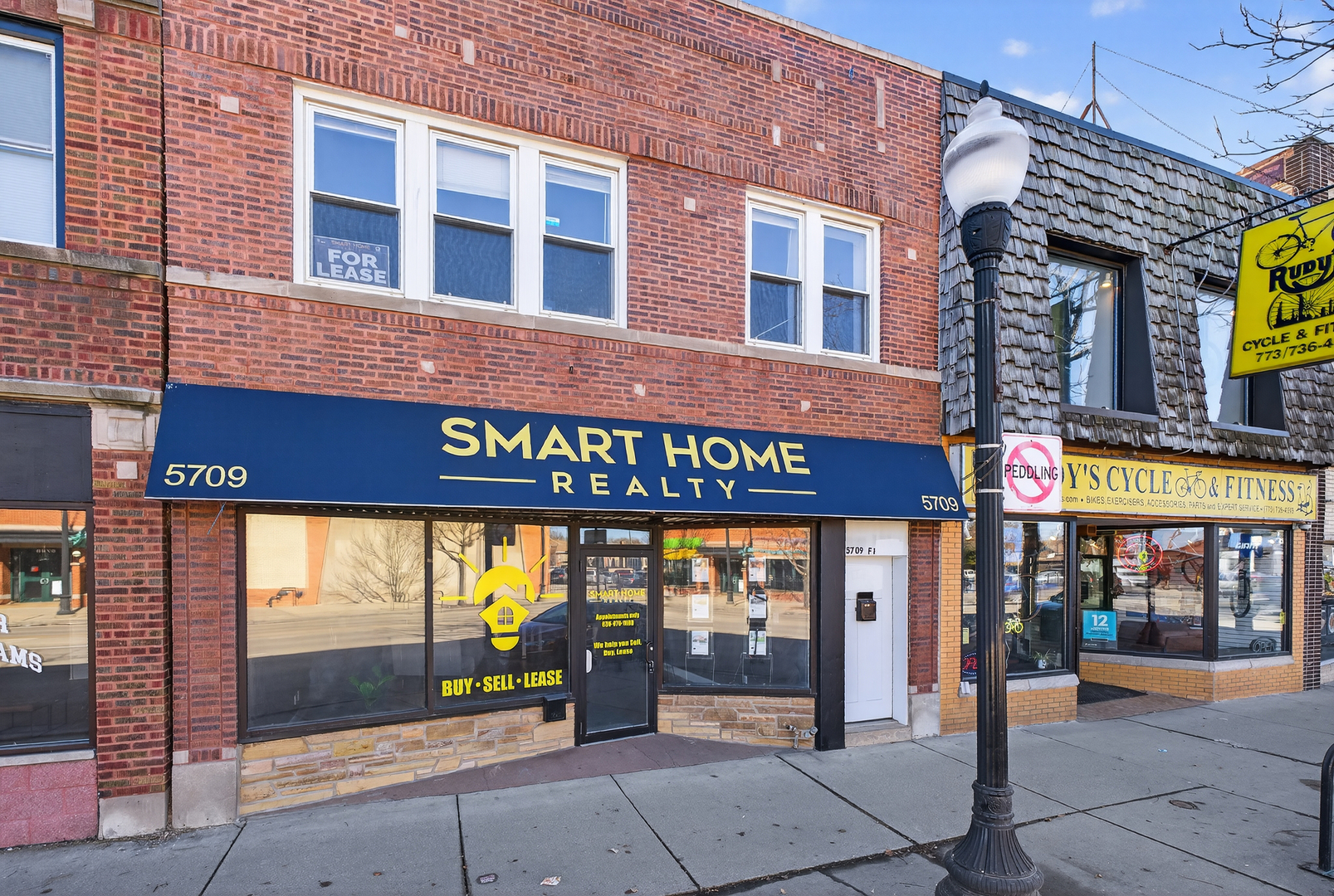 a front view of a building with retail shops