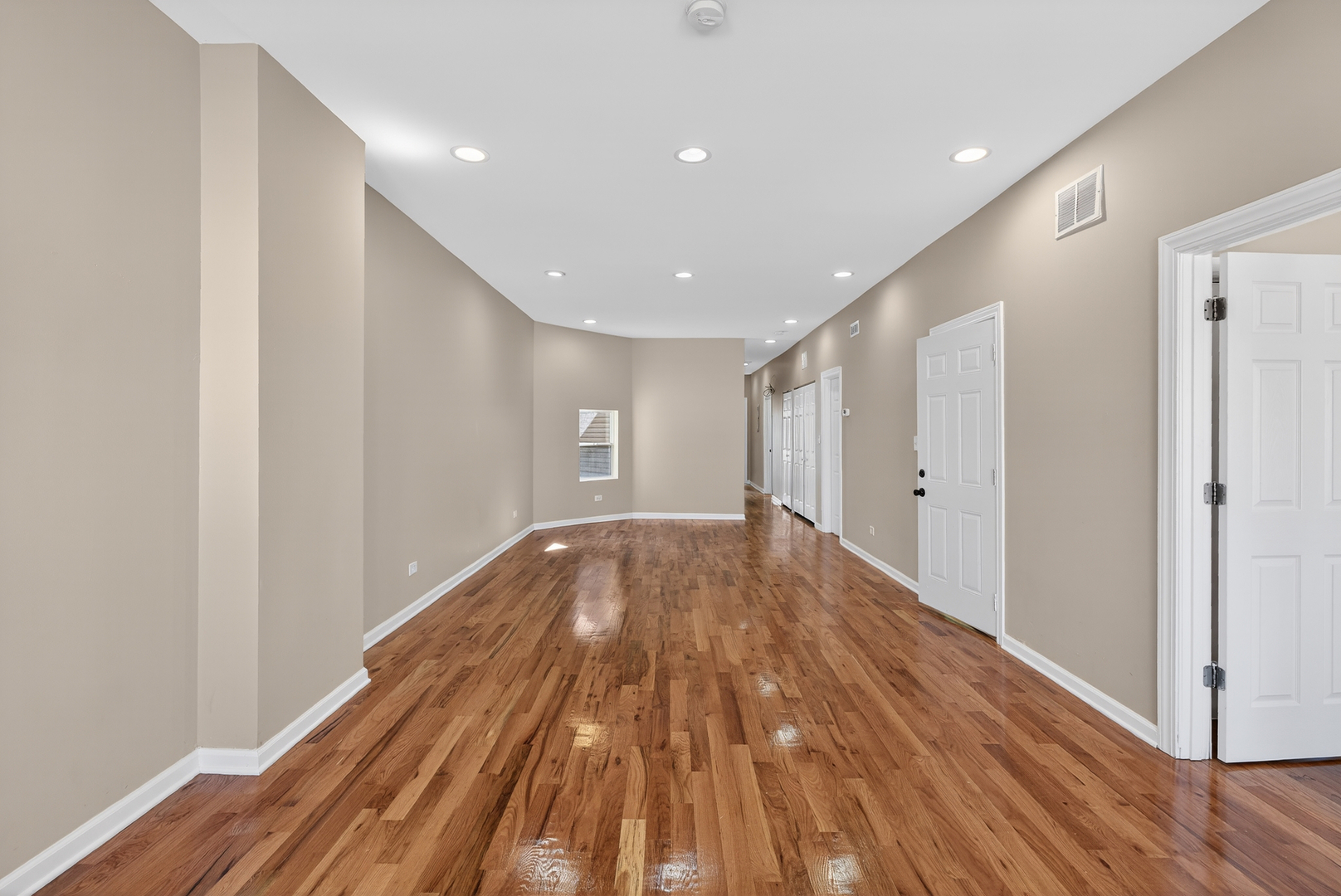 5709 West Irving Park Road, Unit 2 Chicago, IL 60634 - Photo 4 of 8 a view of empty room with wooden floor