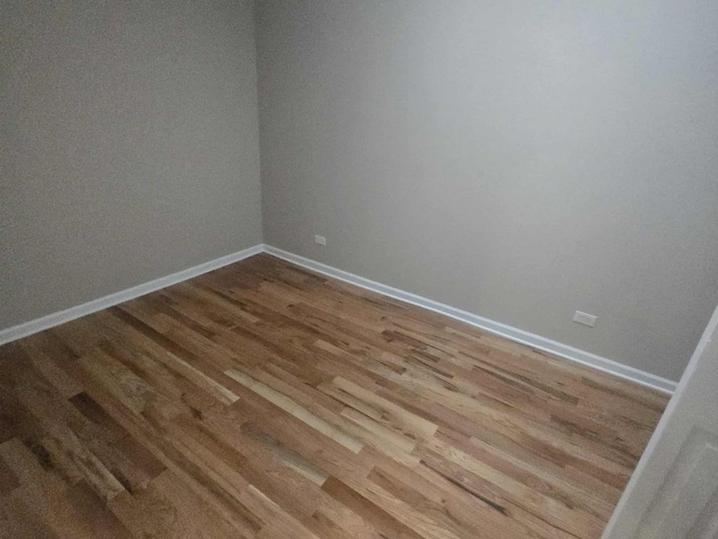 5709 West Irving Park Road, Unit 2 Chicago, IL 60634 - Photo 4 of 8 a view of room with wooden floor