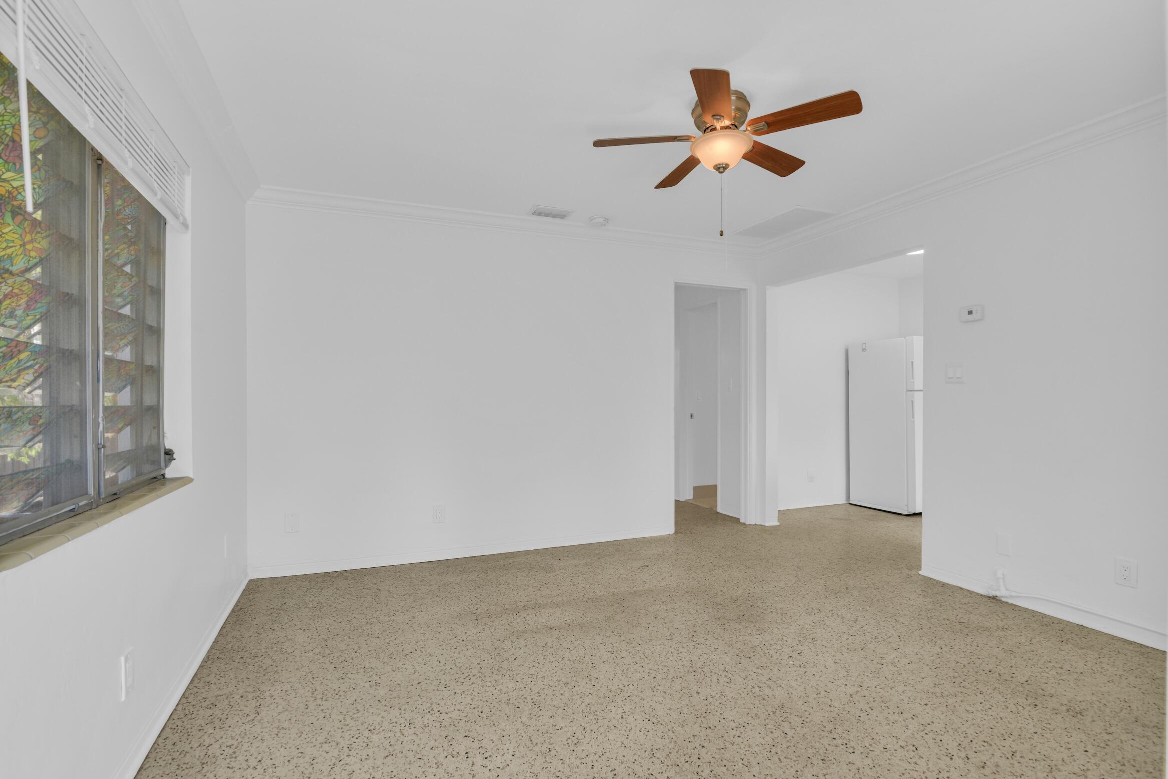728 North L Street, Unit 2 Lake Worth Beach, FL 33460 - Photo 2 of 13 a view of an empty room with a window
