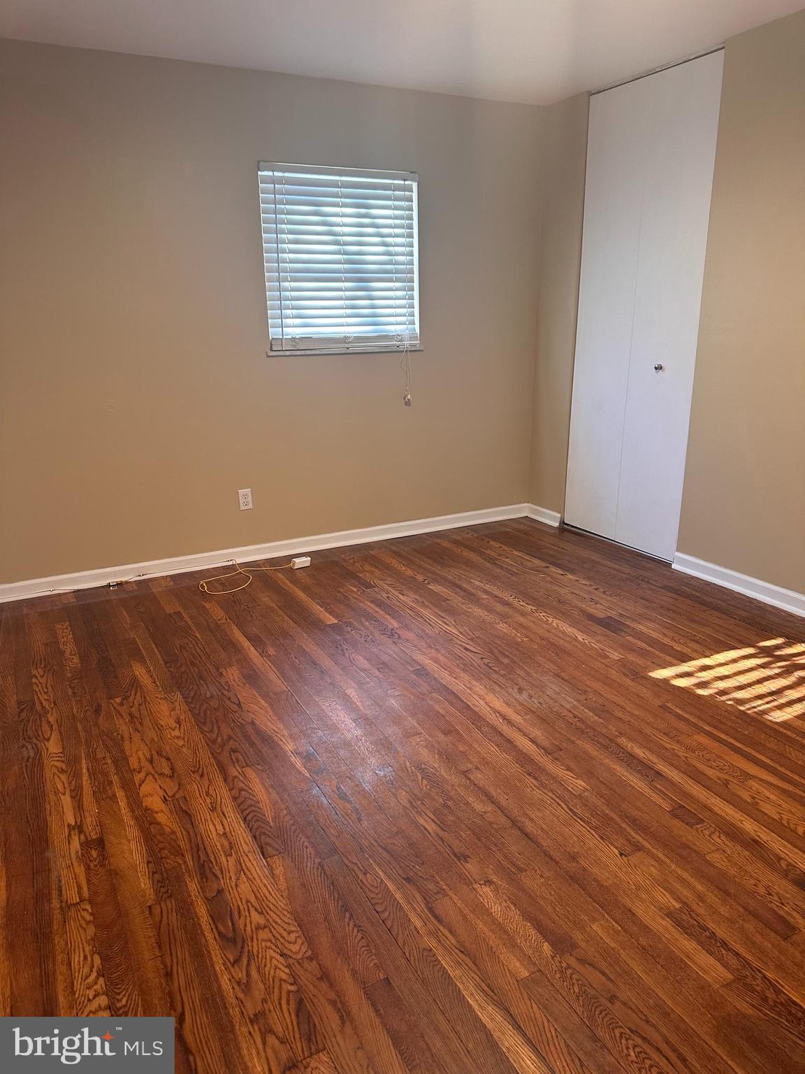1574 Nathaniel Mitchell Road Dover, DE 19904 - Photo 6 of 15 a view of an empty room with wooden floor