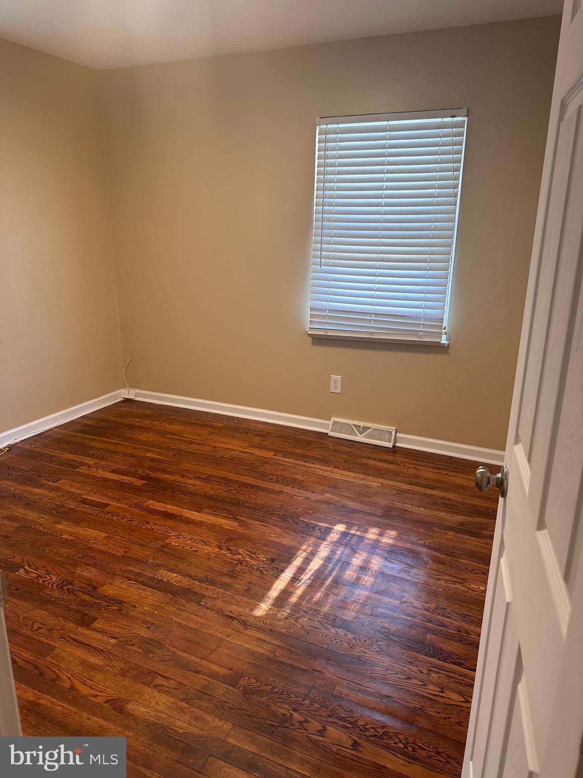 1574 Nathaniel Mitchell Road Dover, DE 19904 - Photo 9 of 15 a view of a room with wooden floor and window