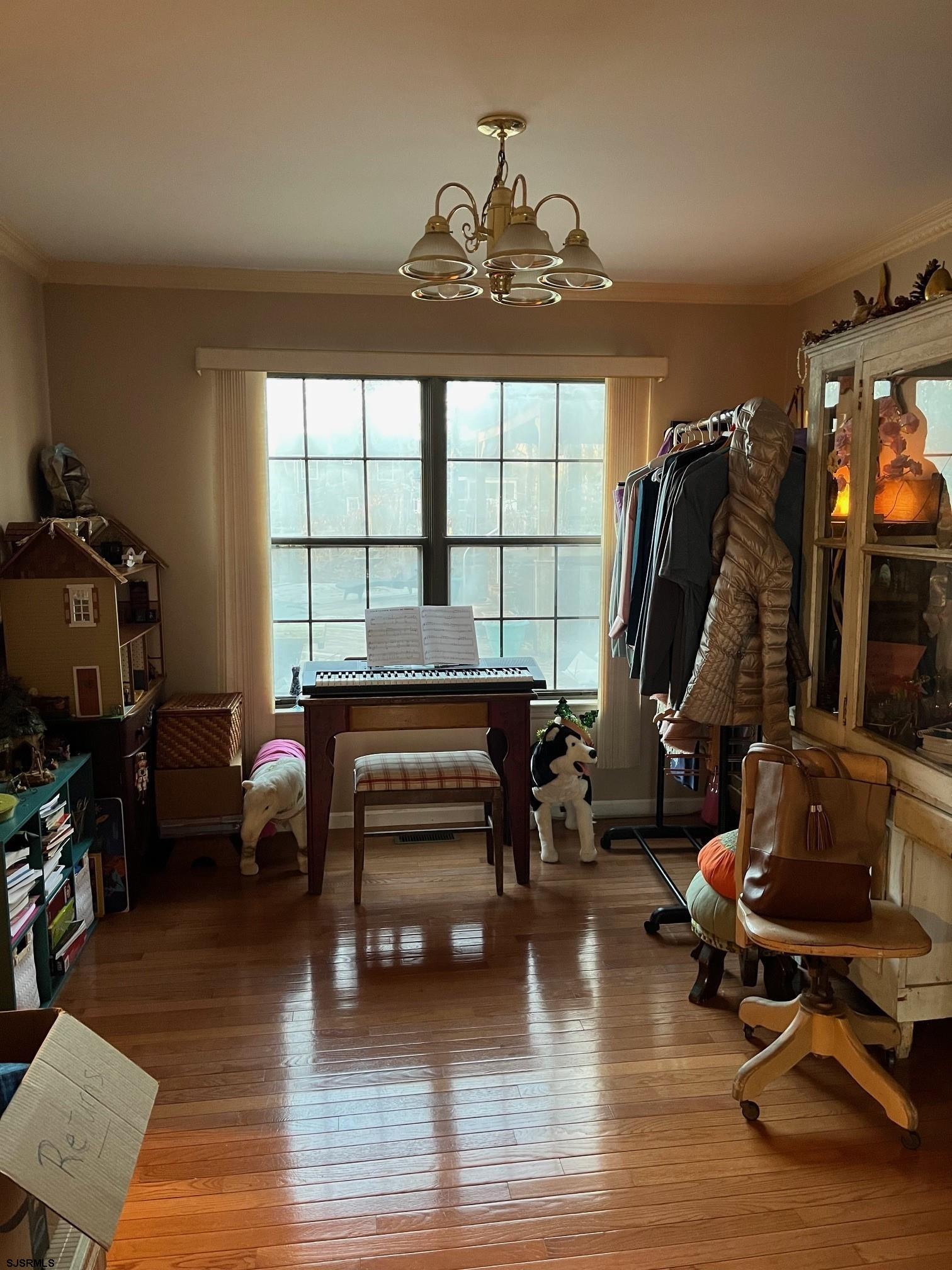 15 East Sunrise Road Woodbine, NJ 08270 - Photo 12 of 23 a living room with furniture a rug a fireplace and a window
