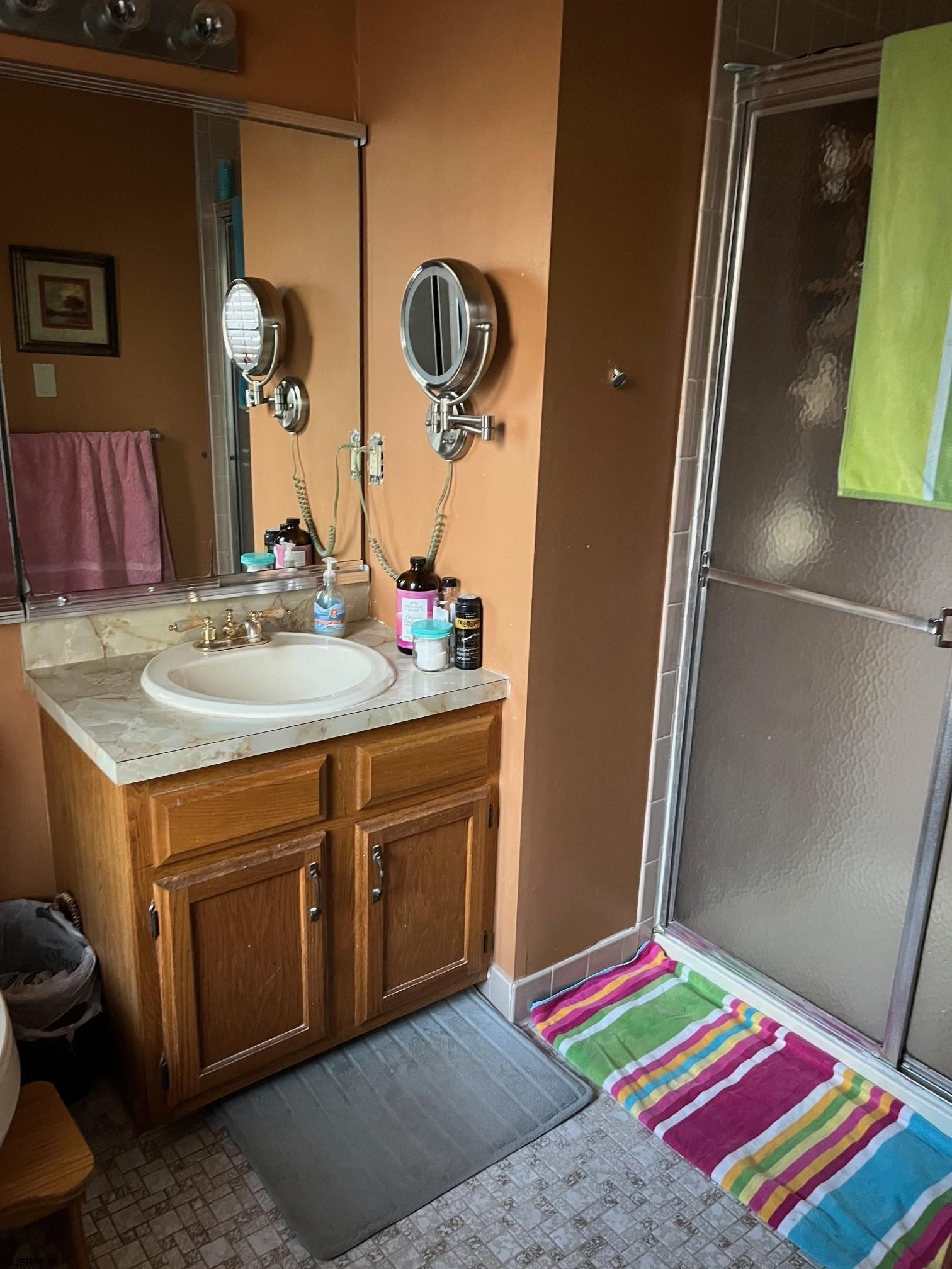 15 East Sunrise Road Woodbine, NJ 08270 - Photo 17 of 23 a bathroom with a sink and a mirror