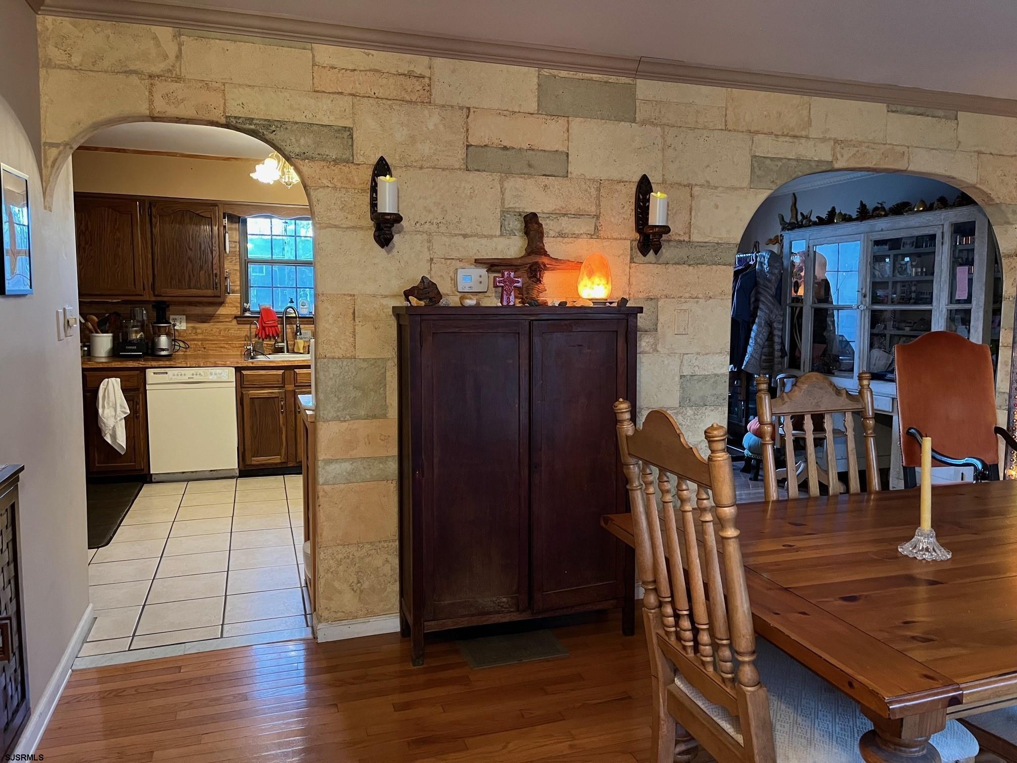 15 East Sunrise Road Woodbine, NJ 08270 - Photo 19 of 23 a kitchen with stainless steel appliances wooden floor and dining table