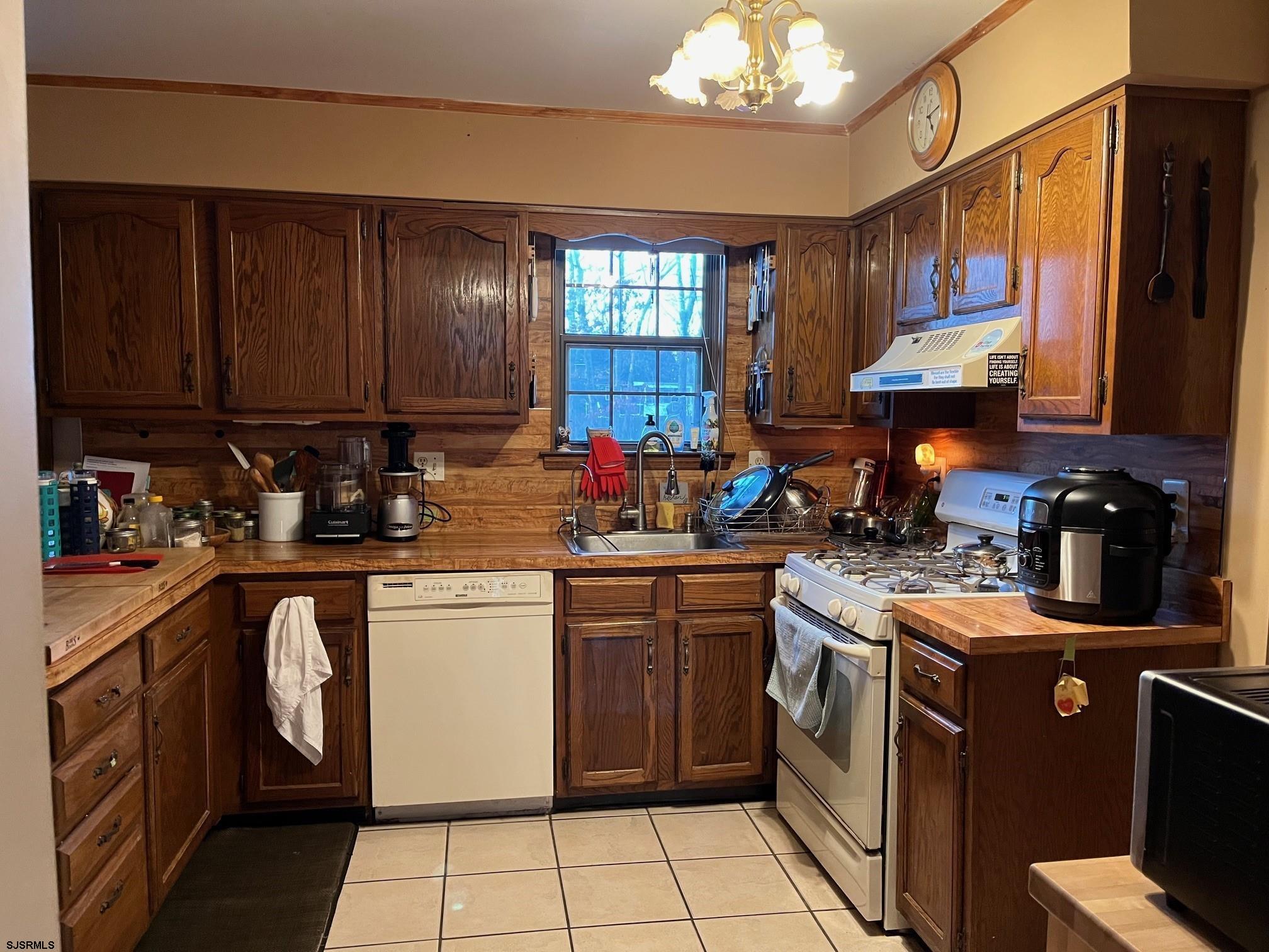 15 East Sunrise Road Woodbine, NJ 08270 - Photo 20 of 23 a kitchen with stainless steel appliances granite countertop a sink stove and refrigerator