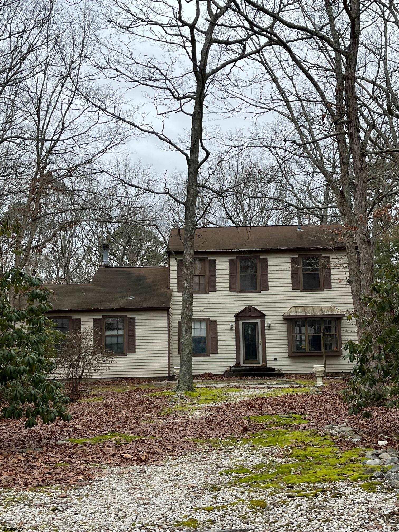 15 East Sunrise Road Woodbine, NJ 08270 - Photo 2 of 23 a front view of a house with garden