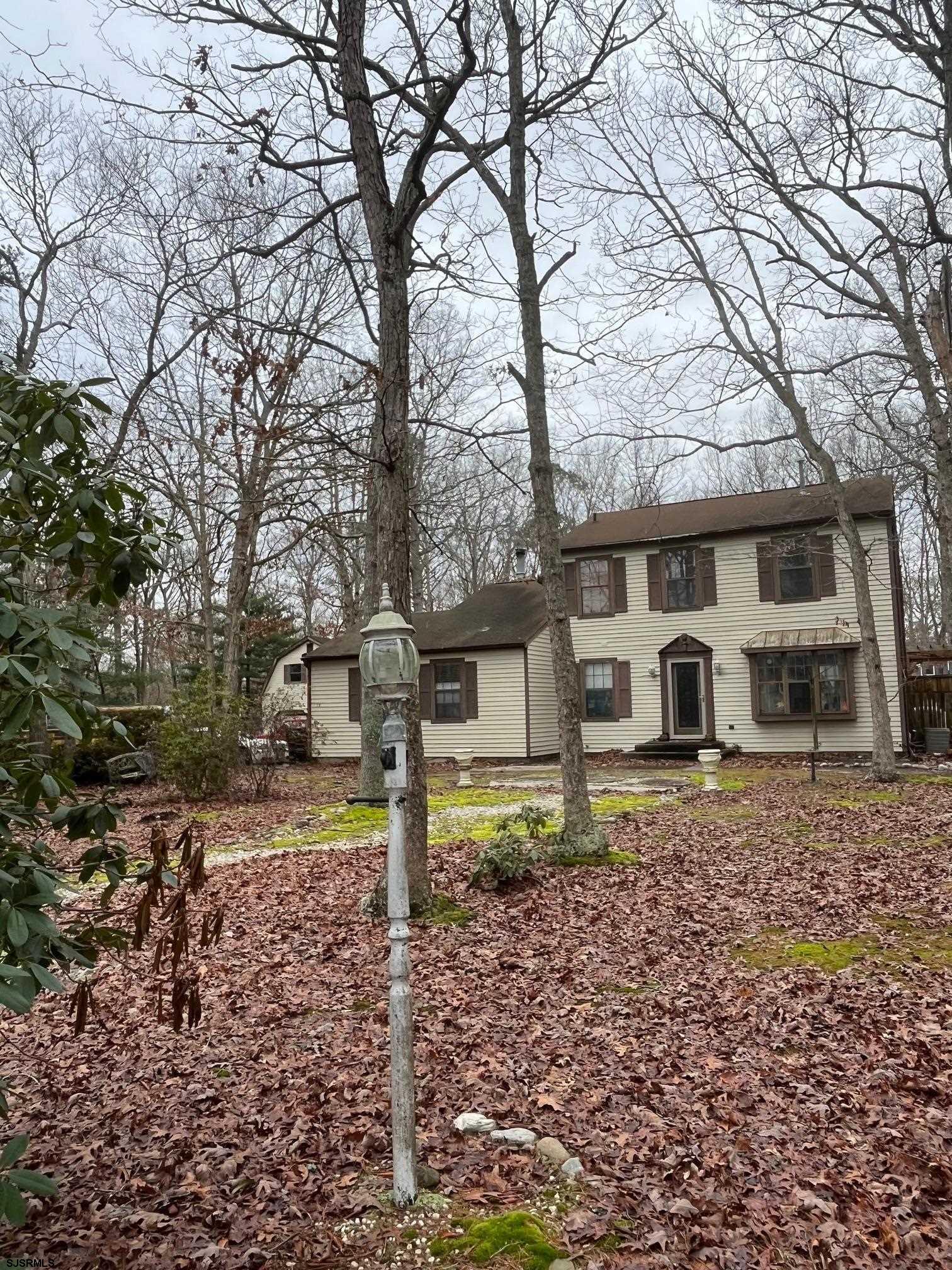 15 East Sunrise Road Woodbine, NJ 08270 - Photo 3 of 23 a front view of a house with a yard