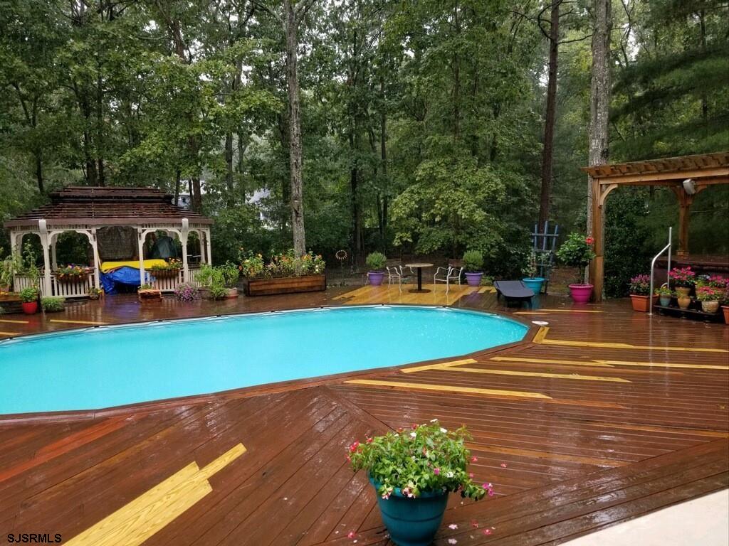 15 East Sunrise Road Woodbine, NJ 08270 - Photo 8 of 23 a view of a tennis ground with large trees