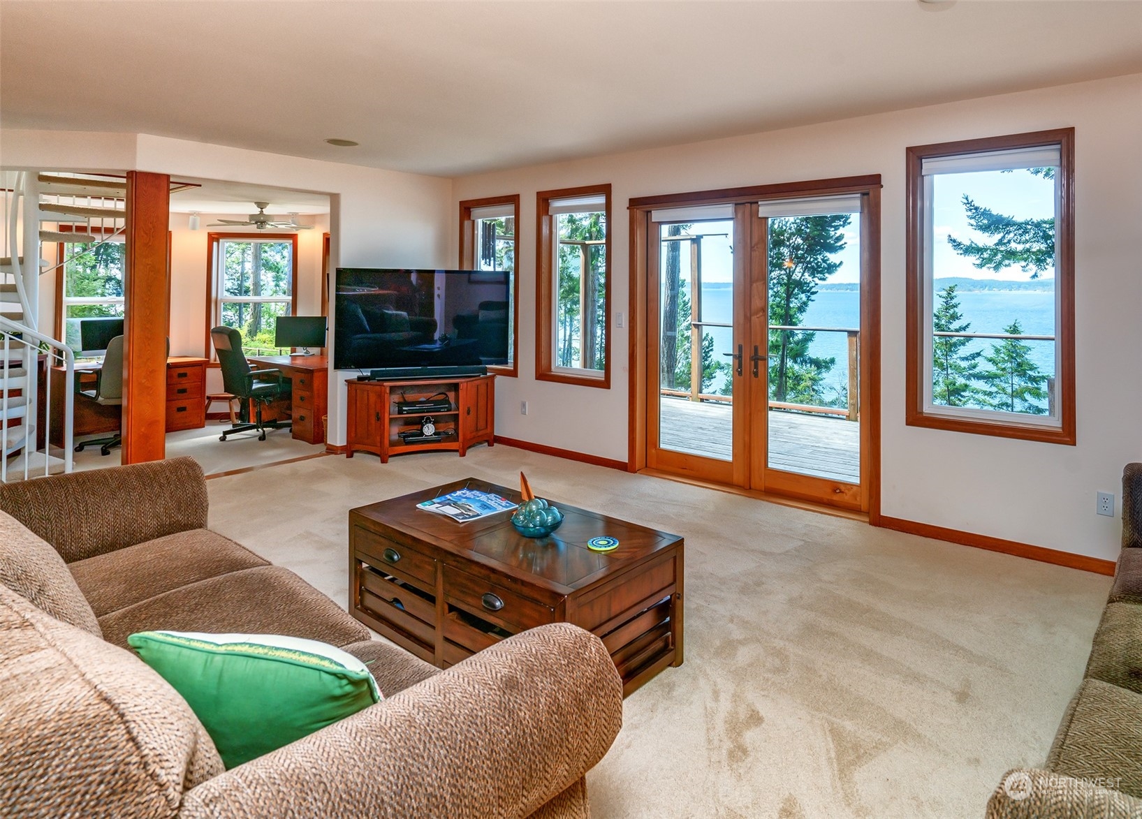 1313 Lopez Road Lopez Island, WA 98261 - Photo 11 of 31 a living room with furniture and a flat screen tv