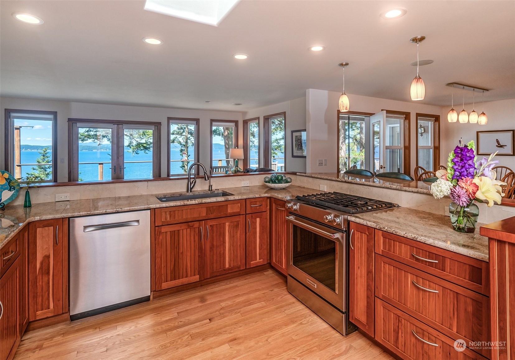 1313 Lopez Road Lopez Island, WA 98261 - Photo 13 of 31 a large kitchen with stainless steel appliances granite countertop a stove and a sink