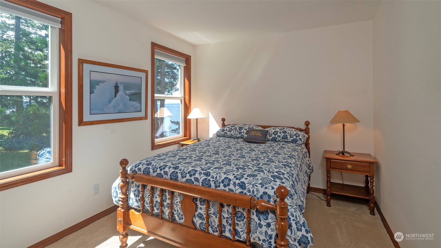 1313 Lopez Road Lopez Island, WA 98261 - Photo 22 of 31 a bedroom with a bed and wooden floor