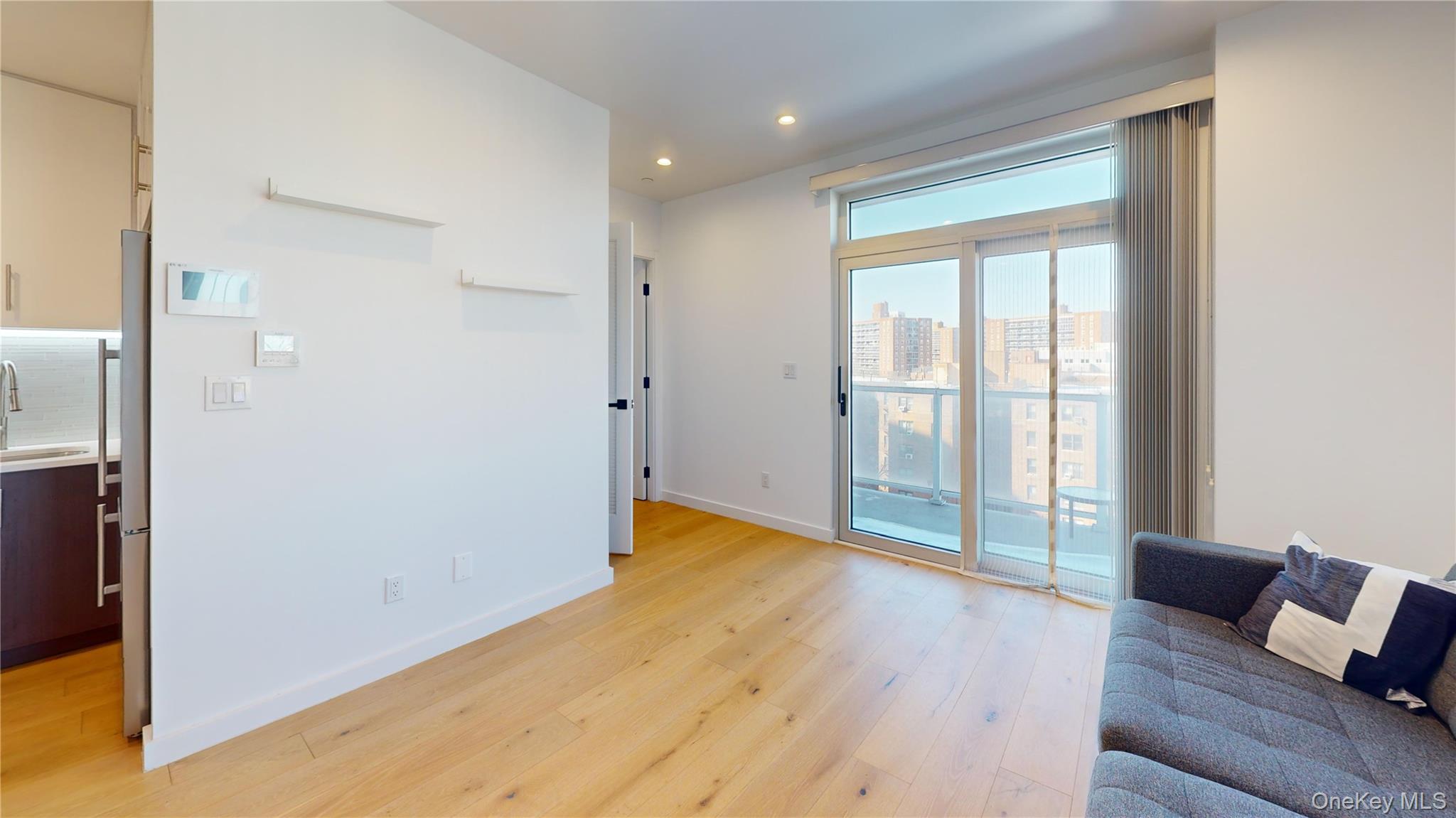 97-29 64th Road Queens, NY 11374 - Photo 6 of 11 a view of room with window and wooden floor