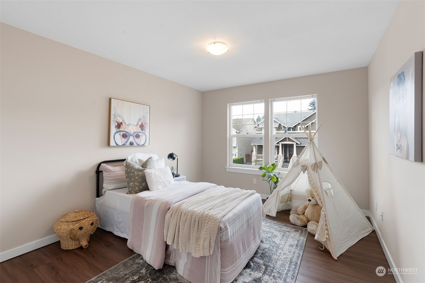 906 Jericho Place Northeast Renton, WA 98059 - Photo 28 of 39 a bedroom with a bed and wooden floor