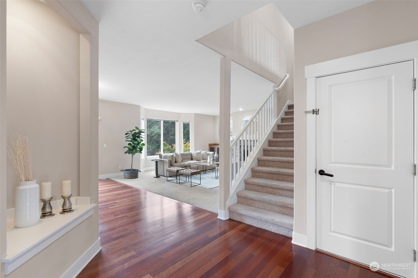 906 Jericho Place Northeast Renton, WA 98059 - Photo 8 of 39 a view of an entryway with wooden floor and a livingroom view